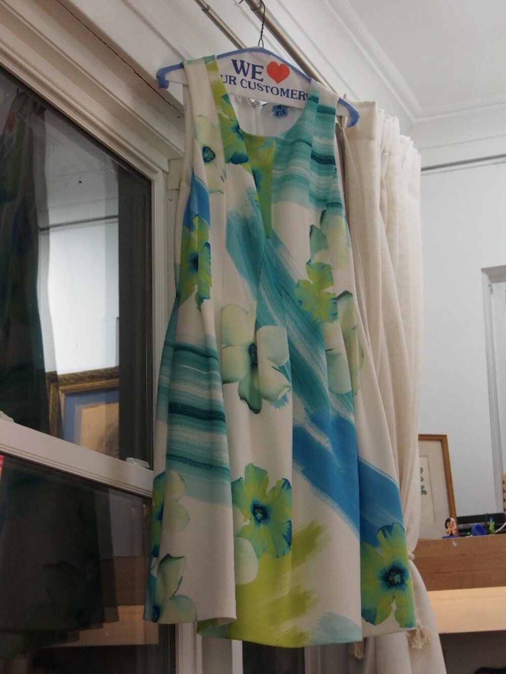 A blue and green dress with  flower pattern